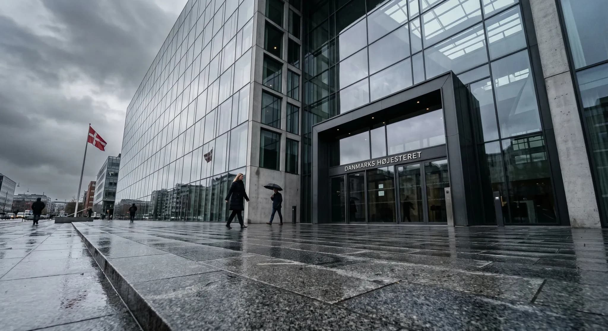 A photorealistic low-angle shot of a modern government building with a glass facade reflecting a gray, overcast northern European sky. In the foreground, a wet stone plaza leads toward the entrance, s