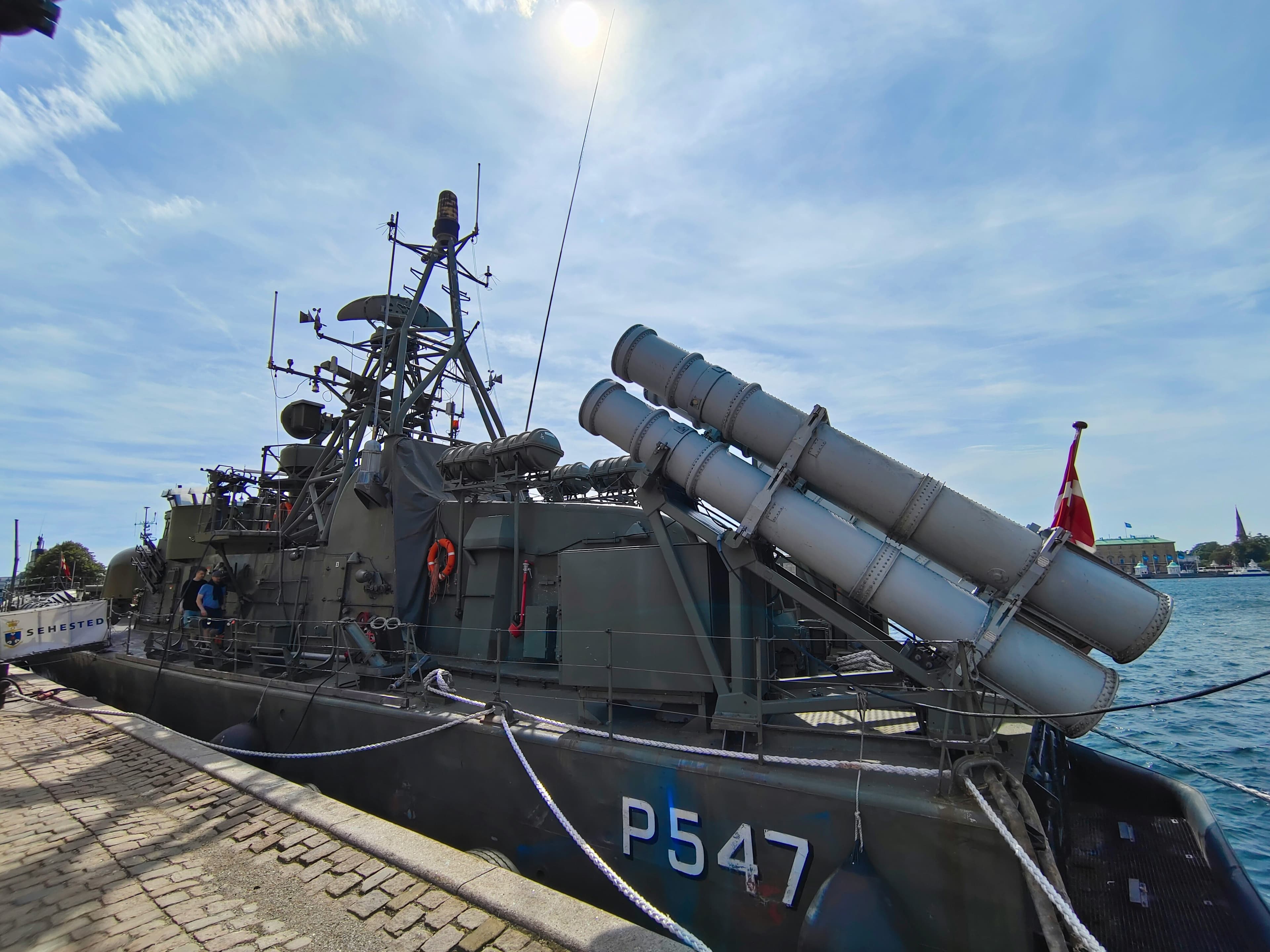 a boat with a large metal object on top of it