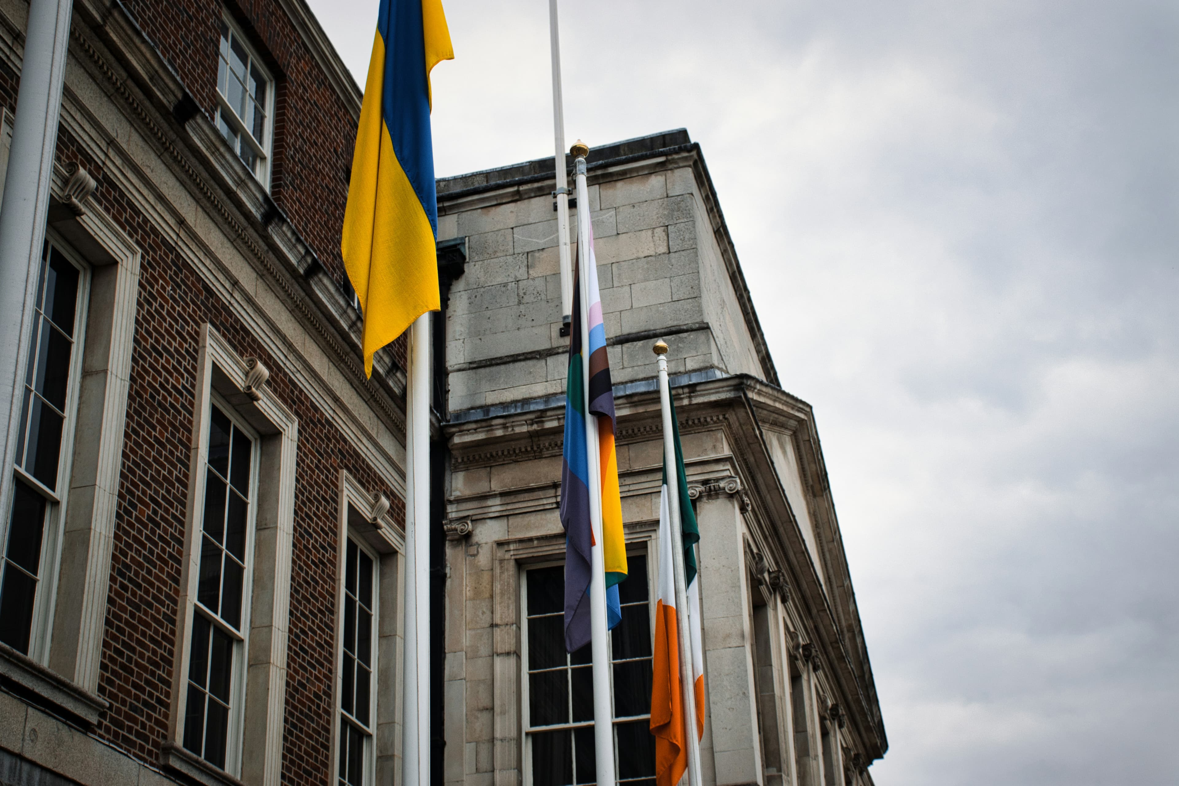 Flags flying at half mast outside building